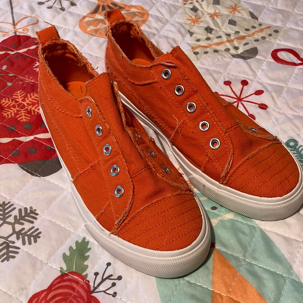 Corky’s orange Babalu sneaker, size 7